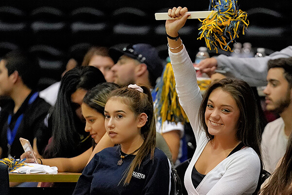 A fan cheers on the Rattlers at Rattler Madness