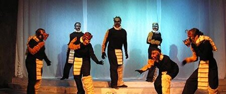 A group of students in wolf costumes for a production of The Ice Wolf