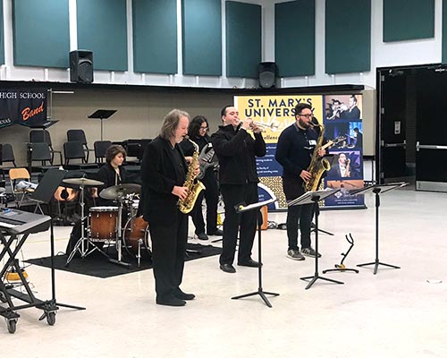 five musicians playing in the jazz combo