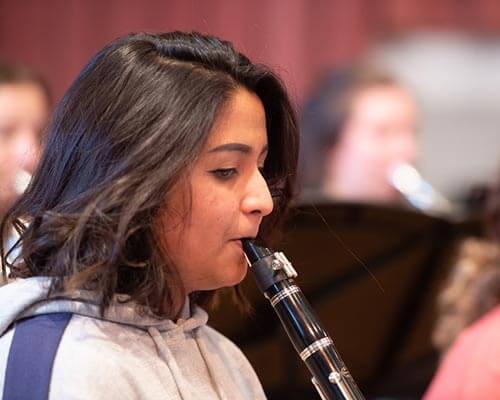 student playing the clarinet during rehearsal