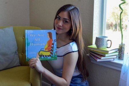 Midori Flores, an Environmental Science major, published her first children's book, We Are All Human.