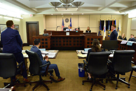 Law students compete in the Lone Star Classic in a courtroom.