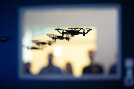 Four drones fly simultaneously in the new Drone Lab.