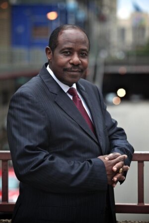 Paul Rusesabagina in a suit jacket