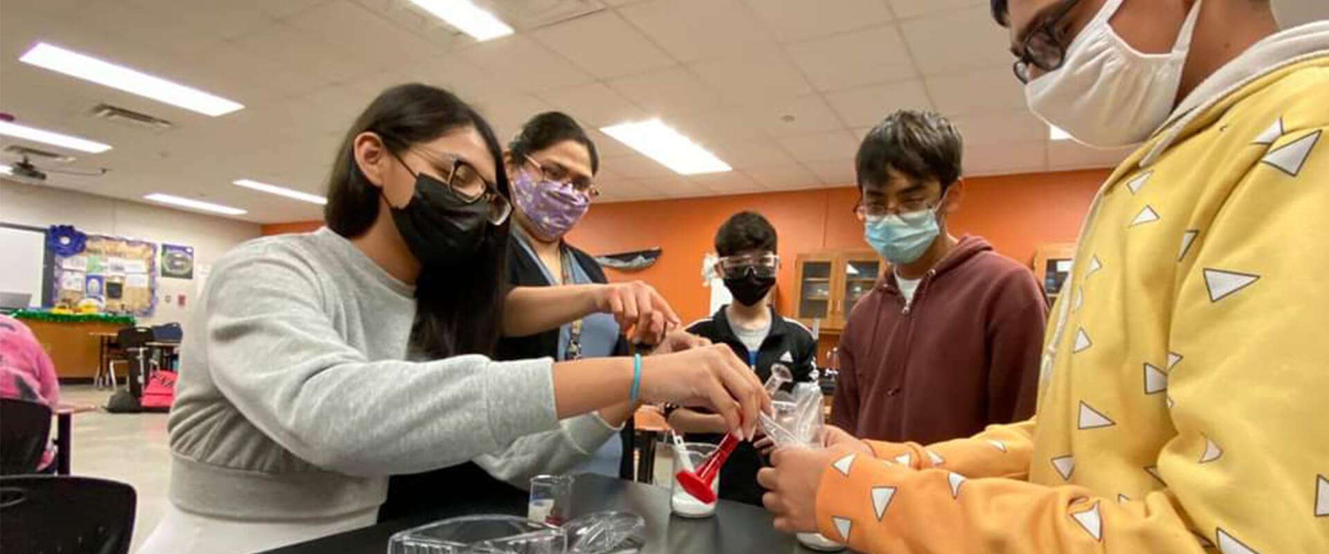Alumna Christina Lopez teaching science to middle schoolers banner