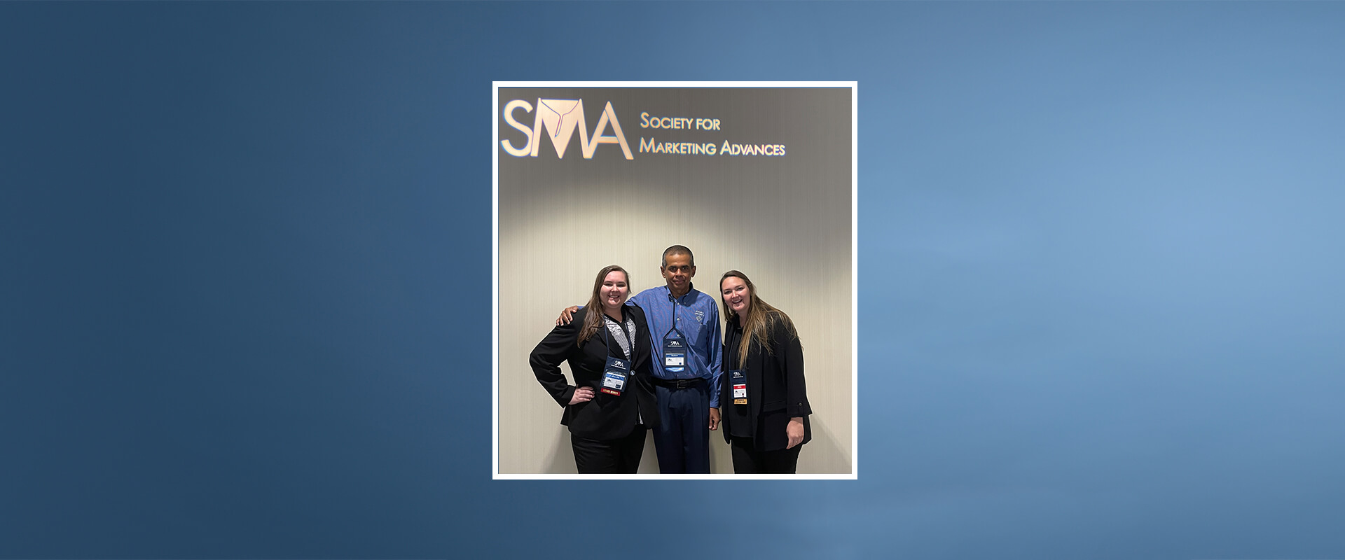 Danielle Hass and Ashley Hass pose with Mathew Joseph, Ph.D., at a conference in Orlando, Florida.