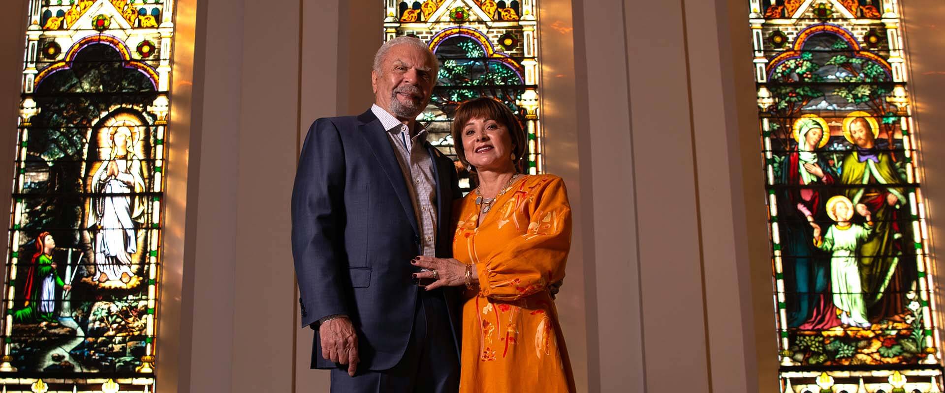 Charles T. Barrett Jr and Melissa Barrett pose in Assumption Chapel
