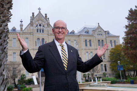 President Tom Mengler stands in front of St. Louis Hall.