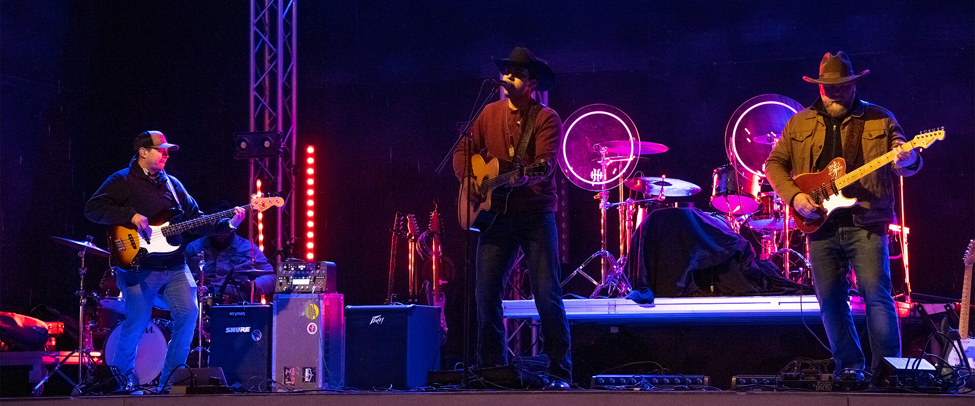 Trey Gonzalez and his band perform onstage.