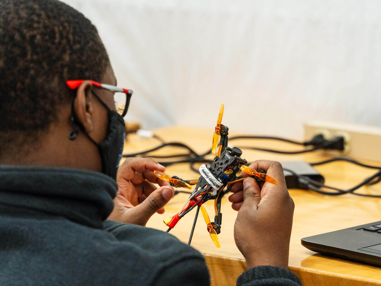 Student tests code for drone during Drones and Automation camp.