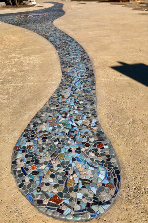Close-up of mosaic in sidewalk of Eisenhower Park