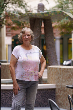 St. Mary's art professor Twyla Arthur poses near her mosaic art piece