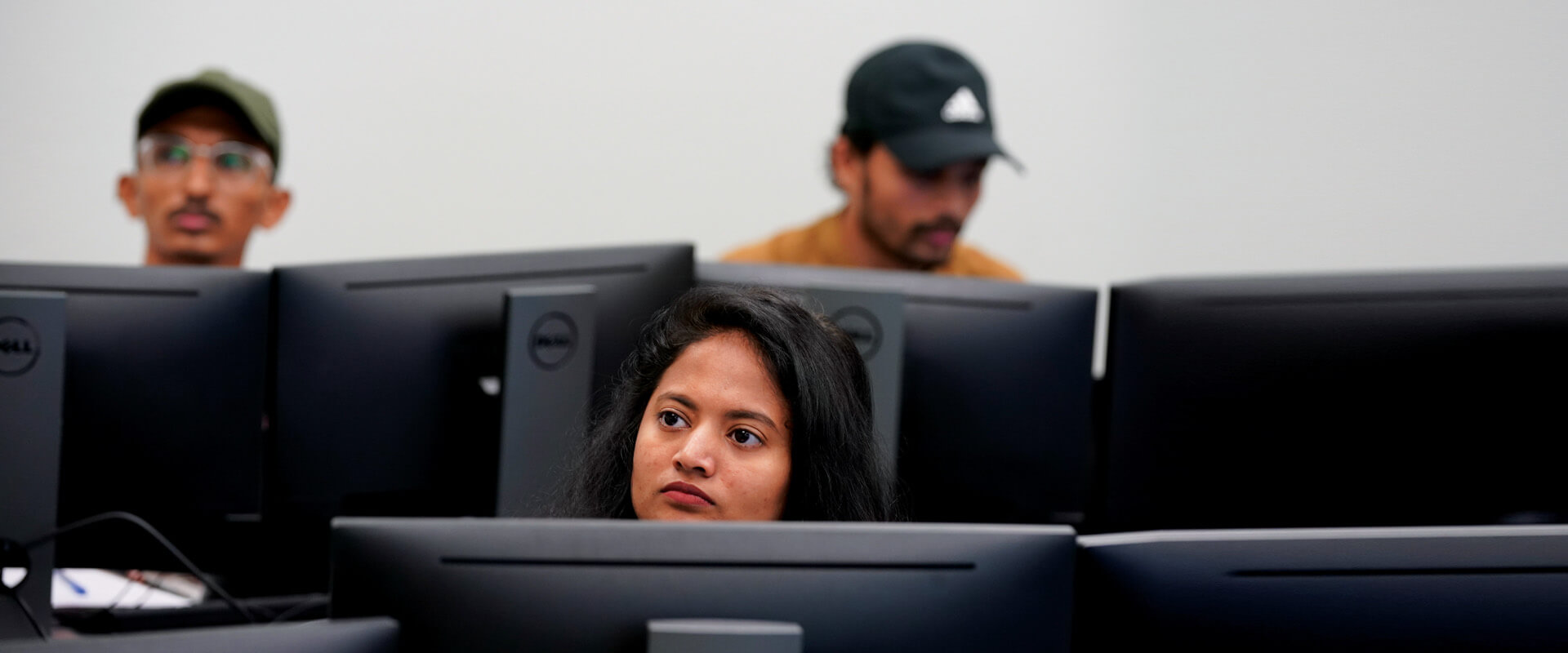 Students listen to a class for their Master of Science in Cybersecurity program.