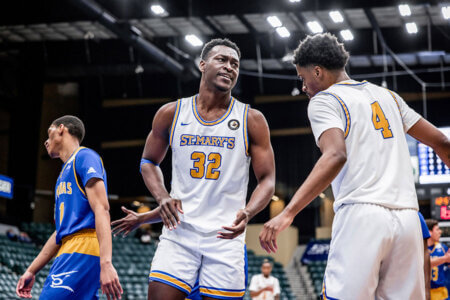 Emmanuel Ewuzie scores a point as a forward on the Rattler Men's Basketball team.