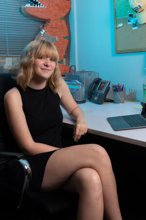 Lily Schow stands in the SGA office.