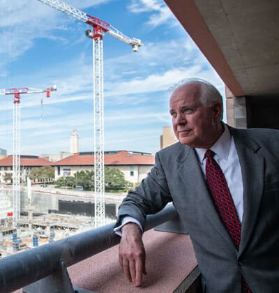 Texas Facilities Commission Executive Director Mike Novak overlooks the Capitol Complex Project construction site in 2019. The site, located at 1801 Congress Ave., is being transformed into a five-story underground parking garage, office building, and grass mall. Credit: Angela Piazza for the San Antonio Report