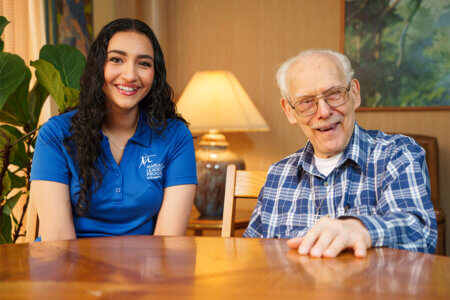 Arely Reyes chats with Brother Dan Stupka at the Marianst Residence on the St. Mary's University campus.