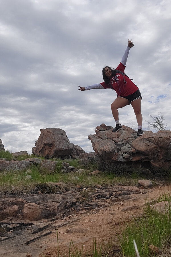 Kayla Garcia stands on a rock during a trip to Estero Llano Grande State Park.