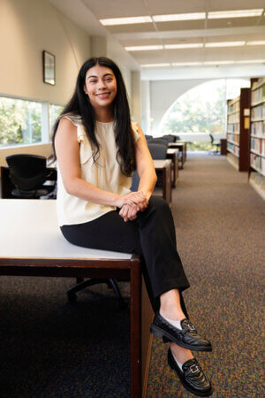 Leslie Espiricueta sits in the law library