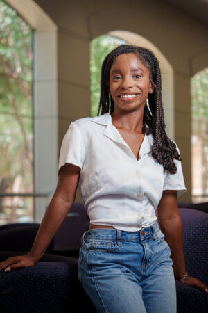 Layla Dickerson visits the Sarita Kenedy East Law Library. She has enrolled in the new B.B.A. in Business and Law.