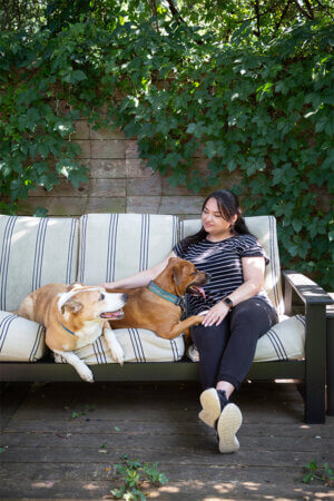 Natalie Kuo, of Austin, spends time with her dogs, Bruce and Chip, during the day.