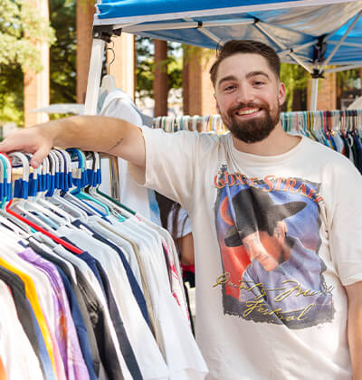 Andrew Tague brings his shop of vintage T-shirts to Rattler Market.
