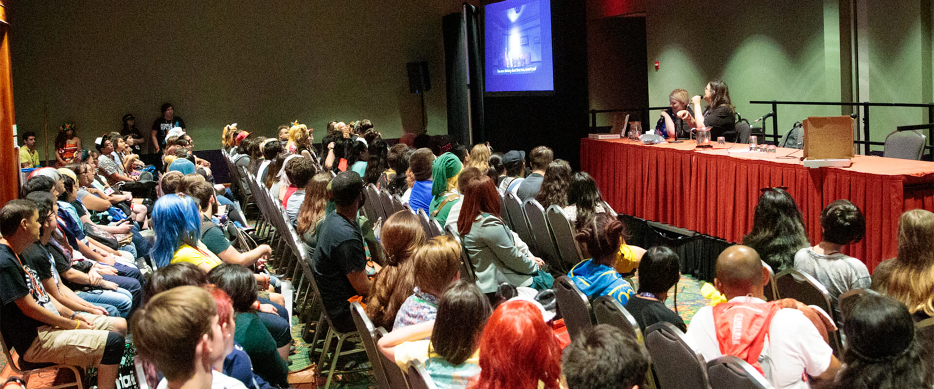 In this courtesy photo from San Japan, a group of attendees attend a panel at the annual convention.