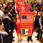 Banner carriers process into Red Mass 2022 in San Fernando Cathedral.