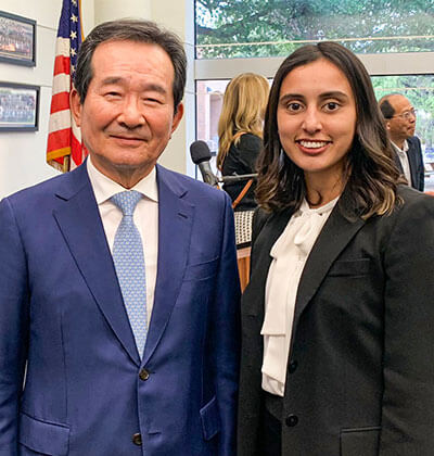 Center for Global Business Studies Student takes photo with proud professor.