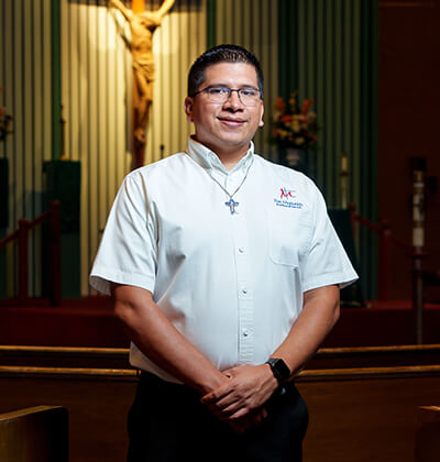 Guillermo “Memo” Peña Contreras poses inside a chapel sanctuary