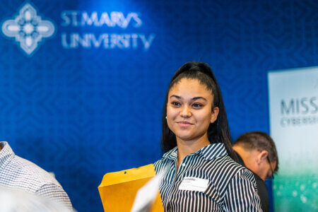 A young woman attends a career fair at St. Mary's University.