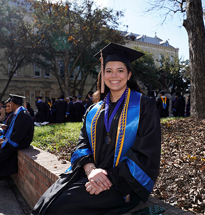 Isabella “Bella” Tamez, sits in The Quad before Commencement on Dec. 9, 2023.