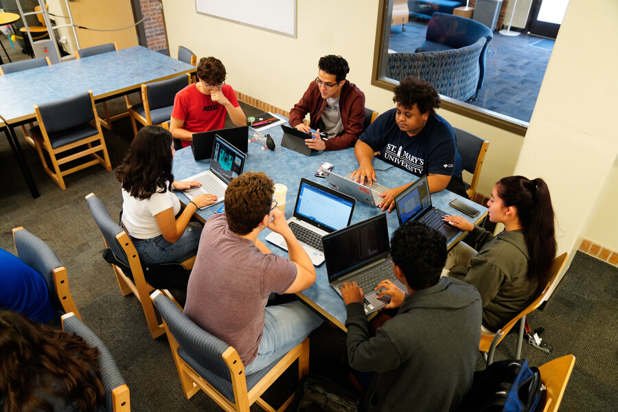 Students study together in the Blume Library.