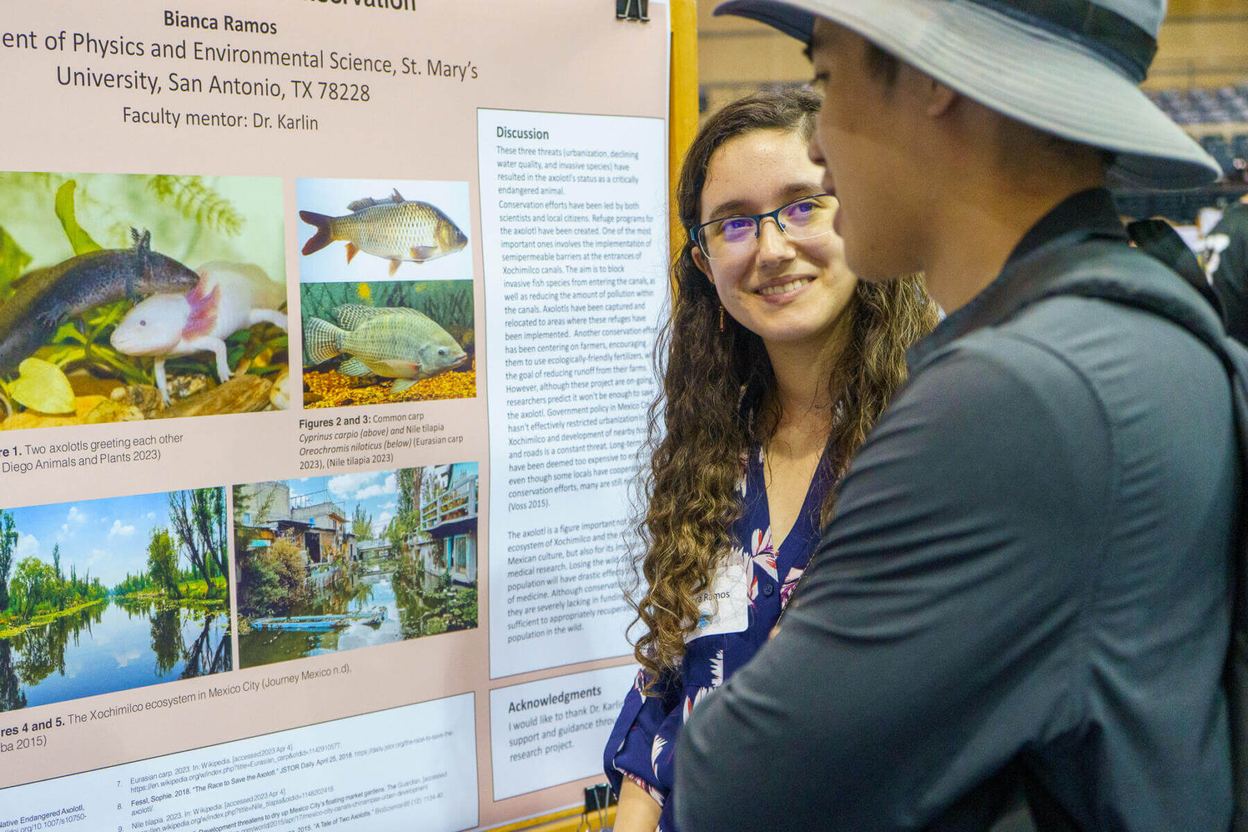 A female student presents her research during the Research Showcase.