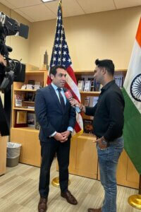 Greg Pardo provides a TV interview as spokesperson for the U.S. Consulate in Mumbai.