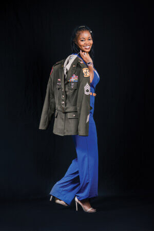 Krendra Harralson (M.Jur. ’24) showcases the uniform she wore while serving in the U.S. Army.