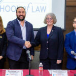 Pictured from left to right are Assistant Dean Jennifer Stevens of St. Mary's Law, Deputy Secretary Emmanuel Loo of Nuevo Leon, Dean Patricia Roberts of St. Mary's Law and Ernesto Santillan of VESS Consulting Group as Roberts and Loo sign the MOU.