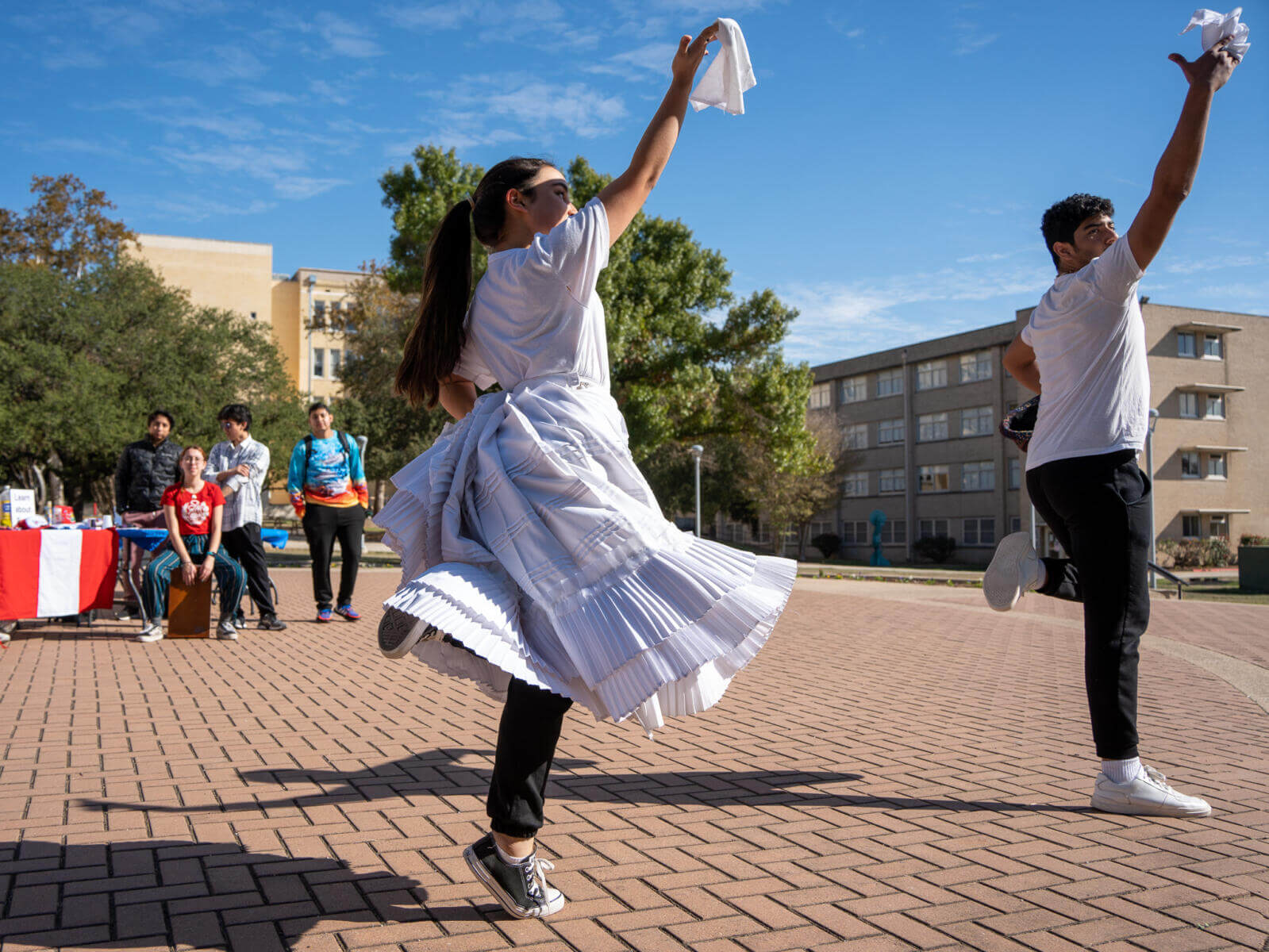 Students participate in the Center for International Studies' celebration of International Education Week with dances from Peru