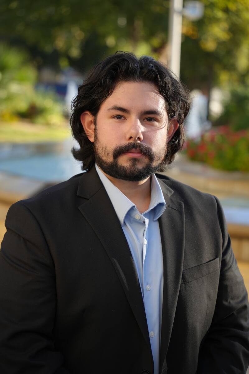 Omar Martinez at St. Mary's University outdoor fountain