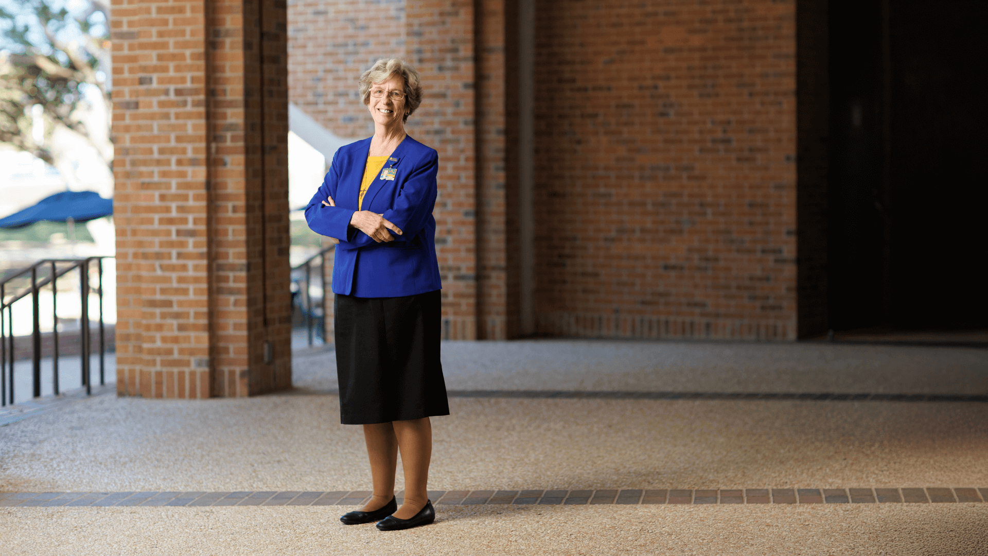 Sister Grace Walle stands outside the Raba Building.