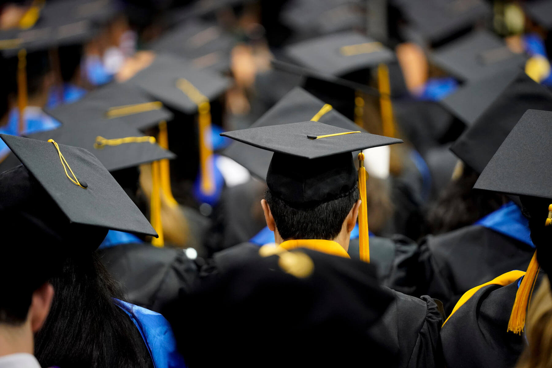 St. Mary's, graduates wearing regalia and grad cap