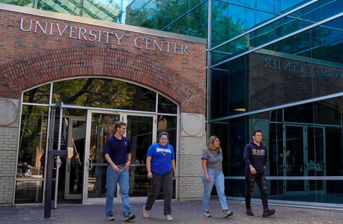 Students walking out from the University Center (UC)