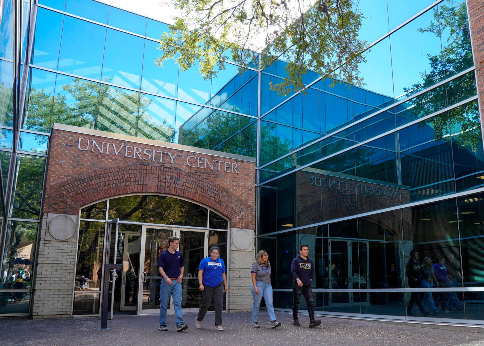 Students walking out from the University Center (UC)