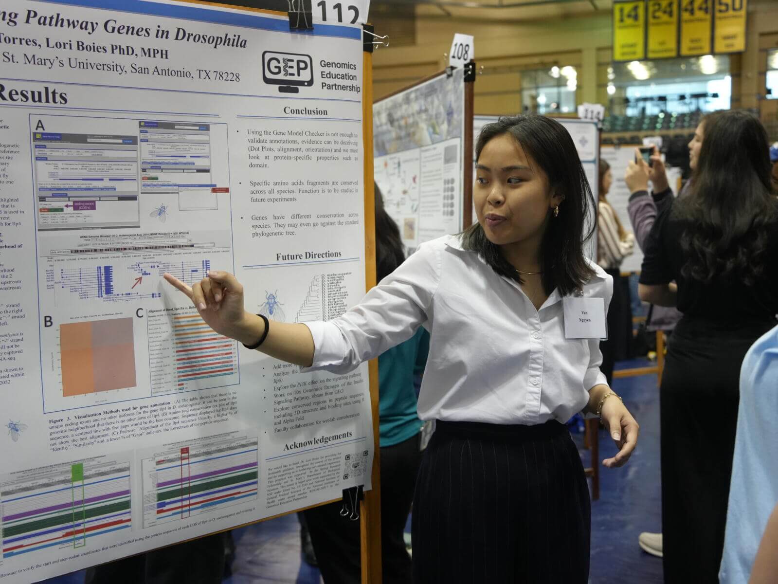 A student presenting their research poster at the 2024 Research Showcase held at St. Mary's University.