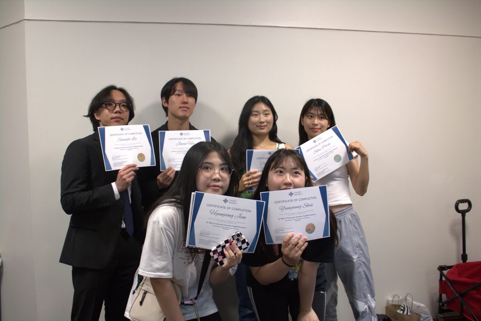 St. Marys University English Program students proudly show their certificates 