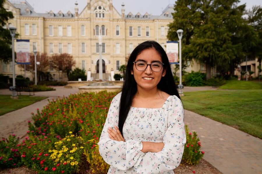 Photo of St. Mary's University student standing in front of St. Louis Hall