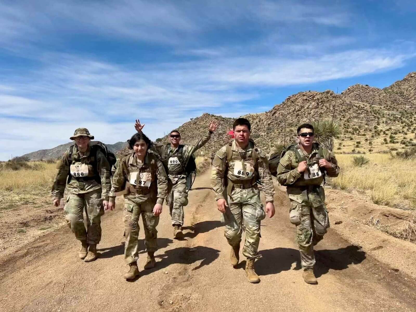 ROTC students walk outdoors on a mission.