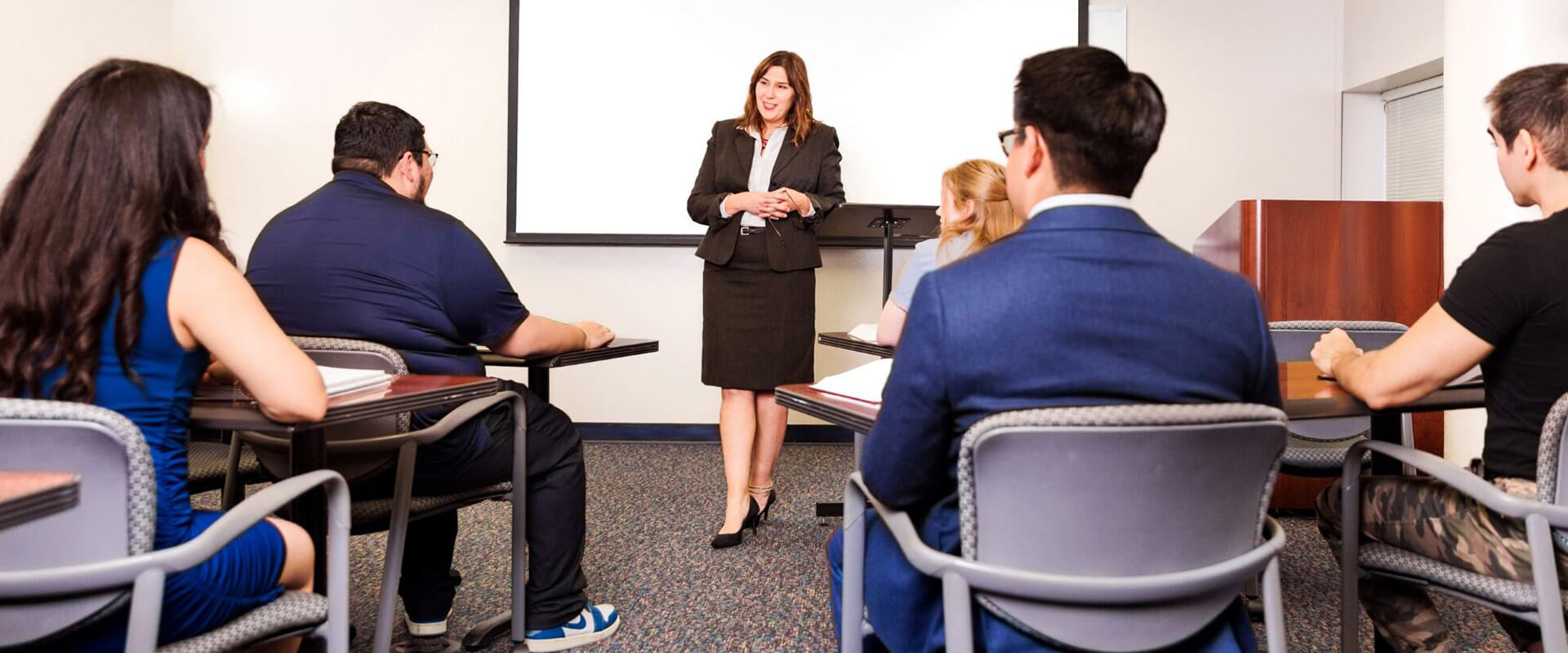 Ramona Lampley, J.D., Professor Law, teaches a course in a classroom in the Sarita Kenedy East Law Library.
