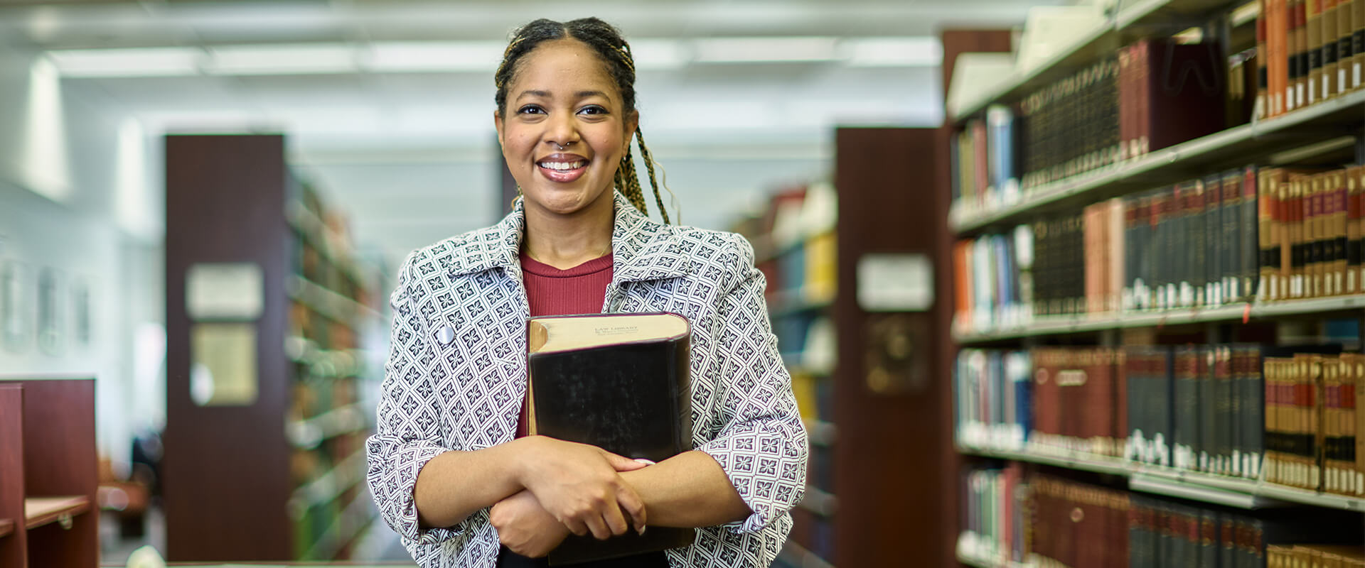 Daeja Hall, who will earn her J.D. on May 17, 2025, is photographed in the Sarita Kenedy East Law Library on campus.