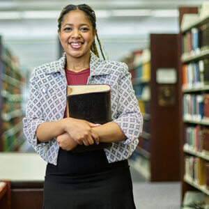 Daeja Hall, who will earn her J.D. on May 17, 2025, is photographed in the Sarita Kenedy East Law Library on campus.